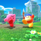 A screenshot from Kirby and the Forgotten Land depicting Kirby and Bandana Waddle Dee celebrating together.